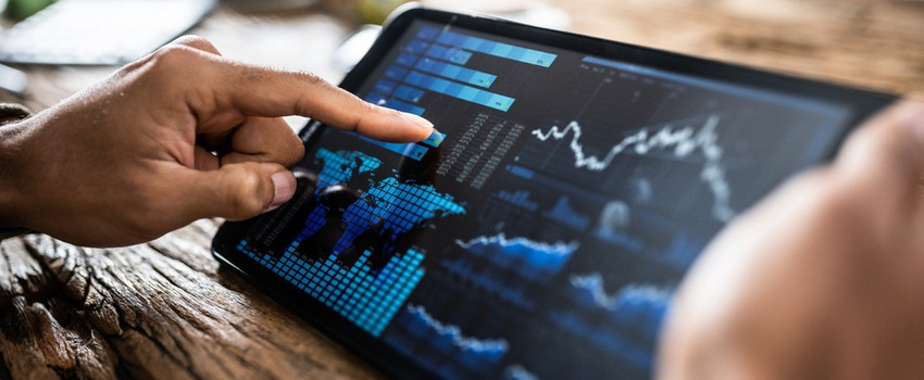 A person reviewing investment performance on a tablet.